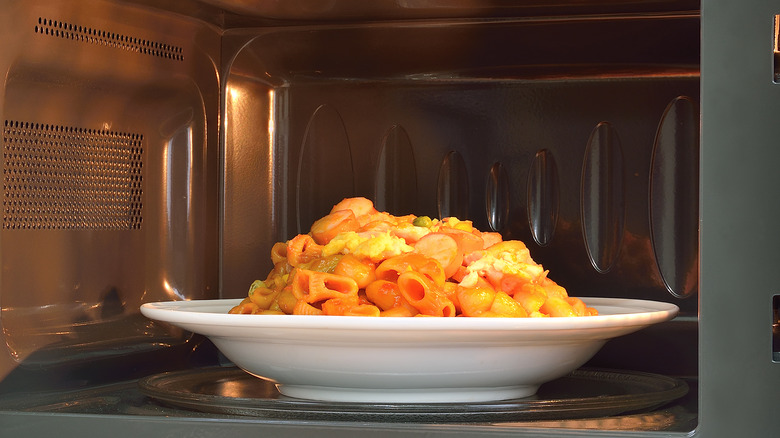 Plate of pasta in microwave
