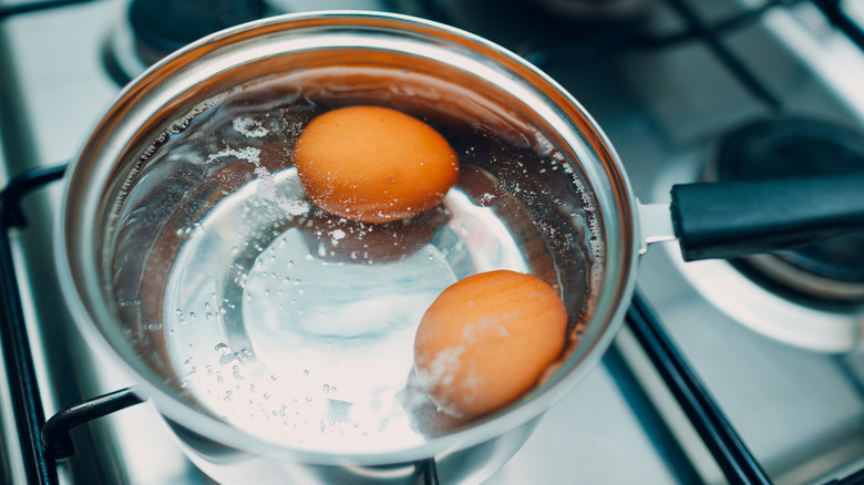 Eggs boiling in a pot