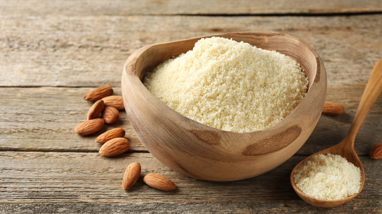 Fresh almond flour in a wooden bowl