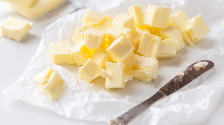 Softened butter in paper