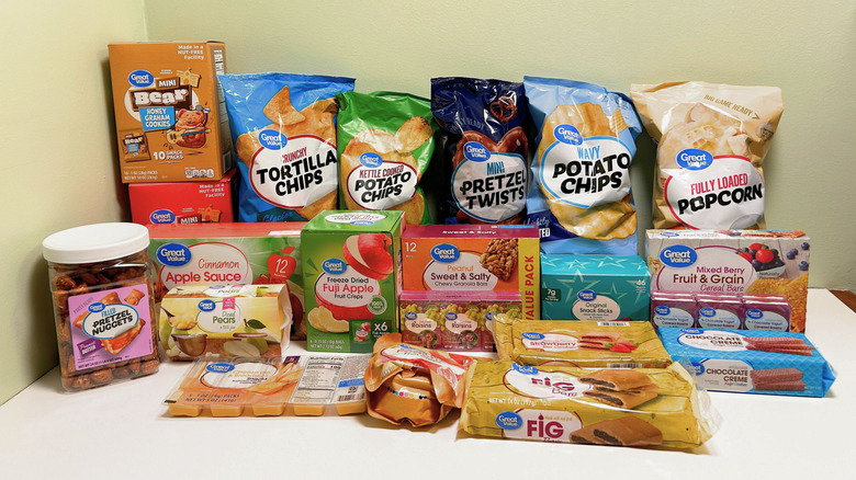 Variety of Great Value snack items on white table