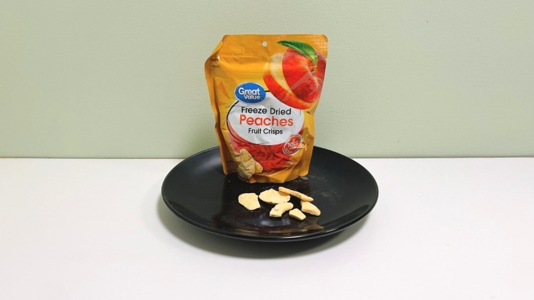 Great Value freeze dried feaches on black plate with bag