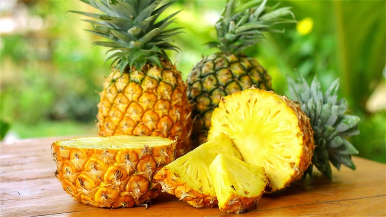 Whole and sliced pineapple
