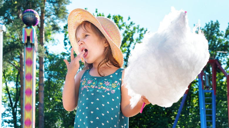 Child eating cotton candy