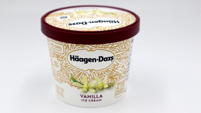 Tub of Haagen-Dazs vanilla ice cream against white backdrop