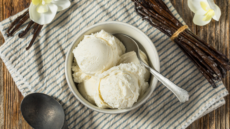 Overhead view of a bowl of vanilla ice cream on a napkin
