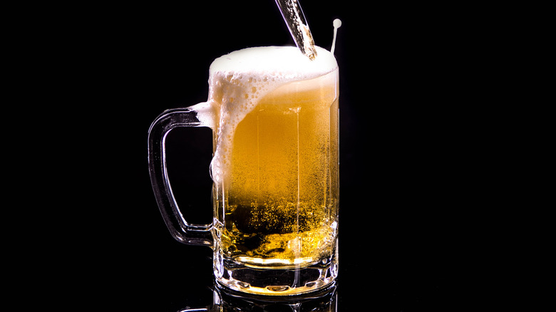 Beer in bottle being poured