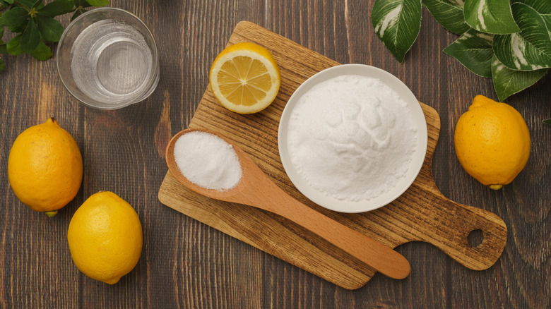 Lemon and citric acid on cutting board