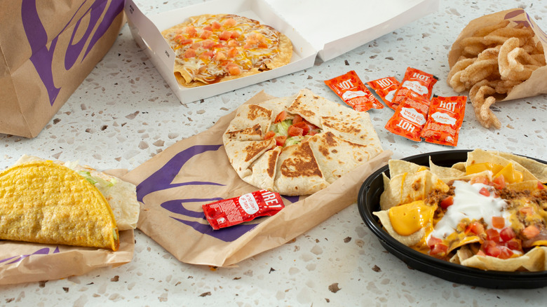 A variety of Taco Bell foods on a white table
