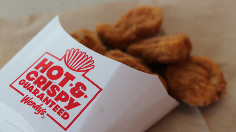 Box of wendy's chicken nuggets spilled out on table