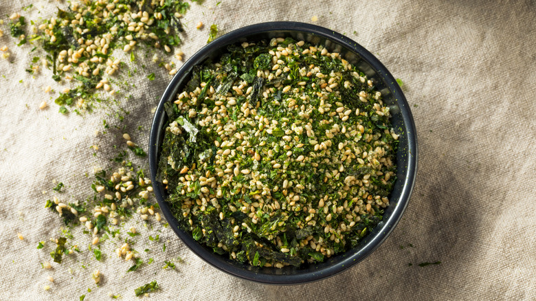 a bowl of furikake Japanese seasoning on a rustic cloth