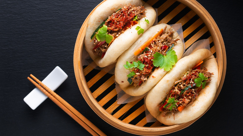 Gua Bao or pork belly buns in a bamboo steamer.