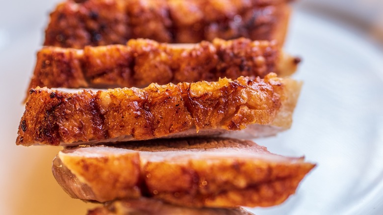 Close-up of sliced duck breast with crispy skin