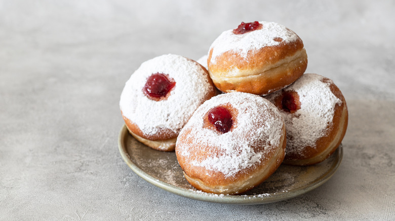 Jelly donuts on plate