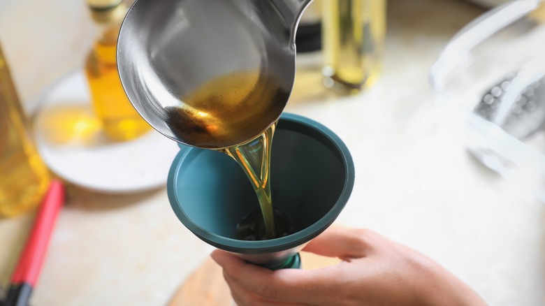 Pouring liquid into a funnel 