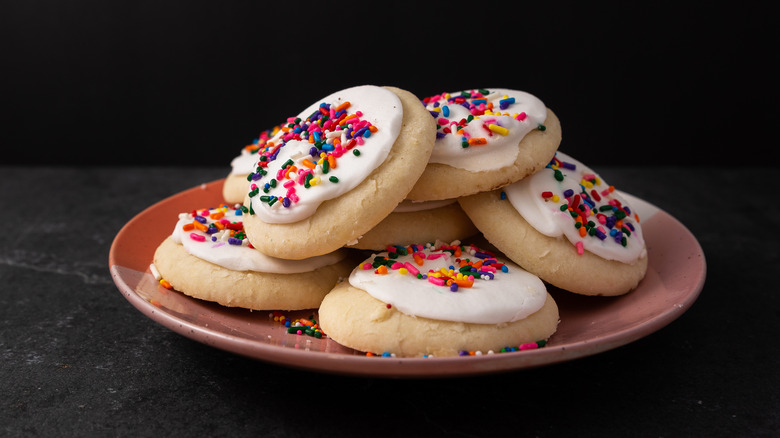 Sugar cookies with frosting and rainbow sprinkles