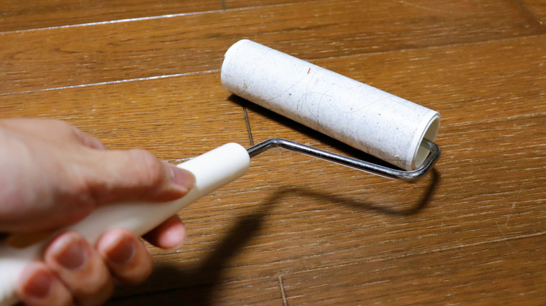 A lint roller on wooden floors