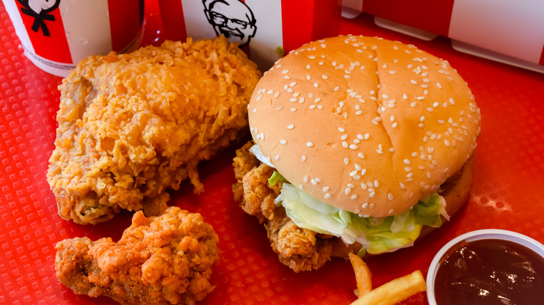 fried chicken burger covering tray