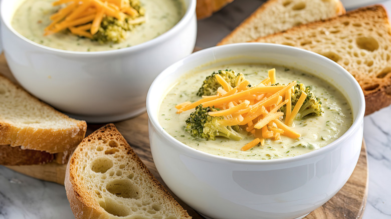 two bowls of broccoli cheddar soup