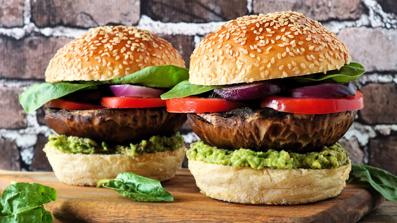 Portobello burgers on wood board