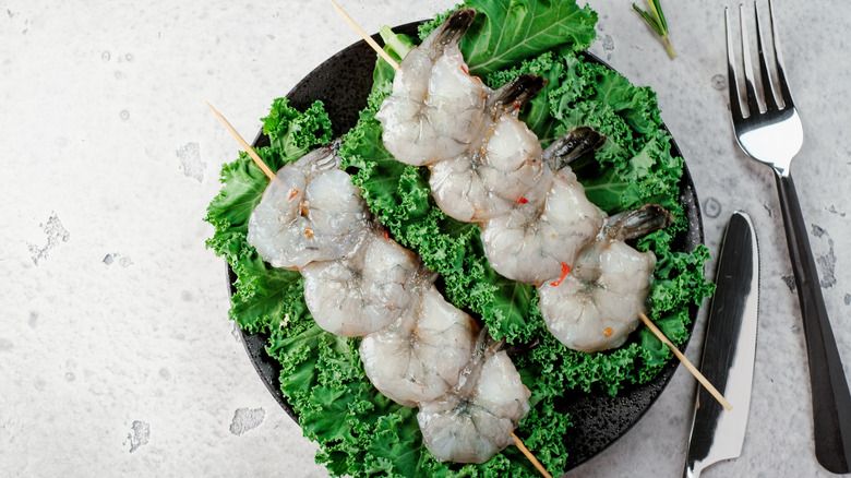 Raw shrimp on skewers