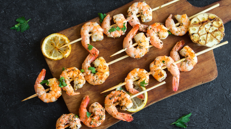 Grilled shrimp on a wooden board