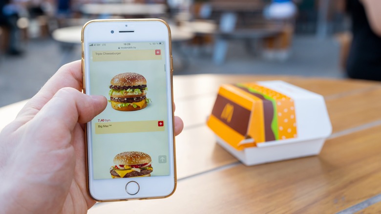 A person scrolls on the McDonald's app
