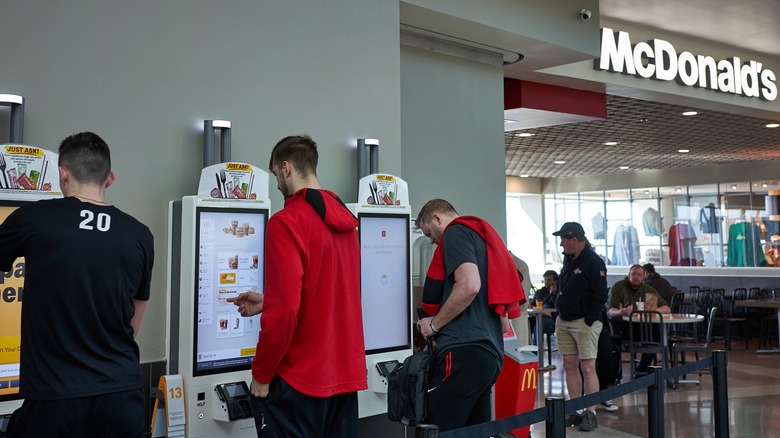 McDonald's customers at kiosks