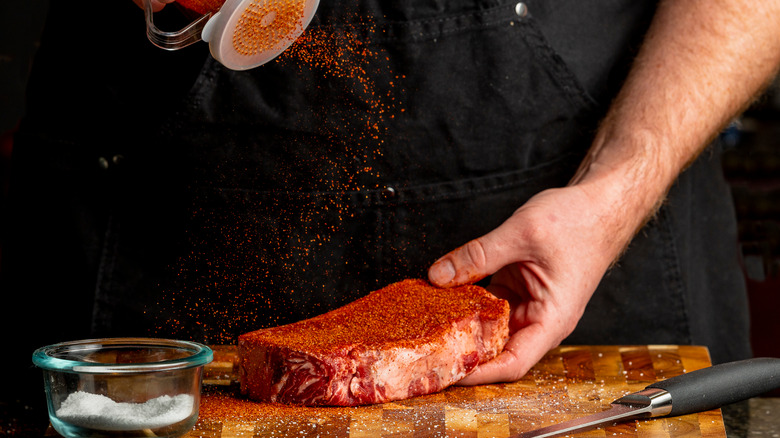 Dry rub sprinkled on steak