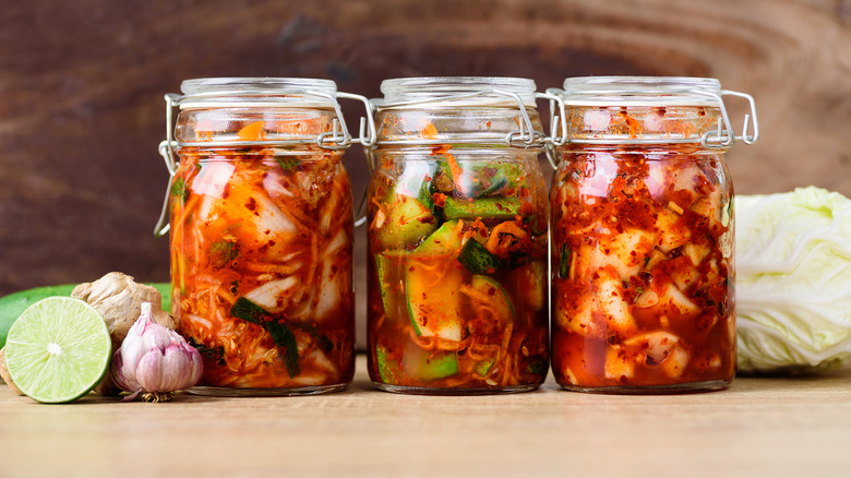 three jars full of kimchi