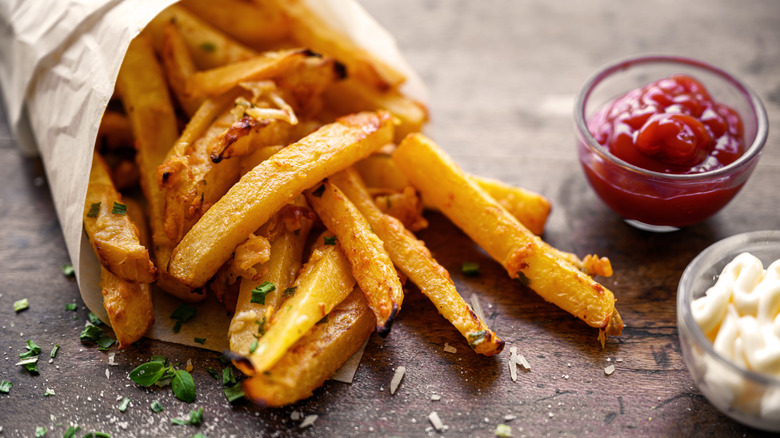French fries with ketchup and mayonnaise 