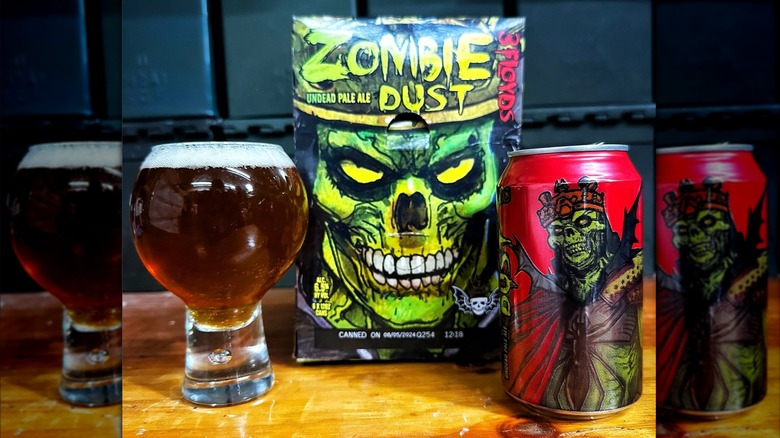 can and glass of zombie dust beer with case on table