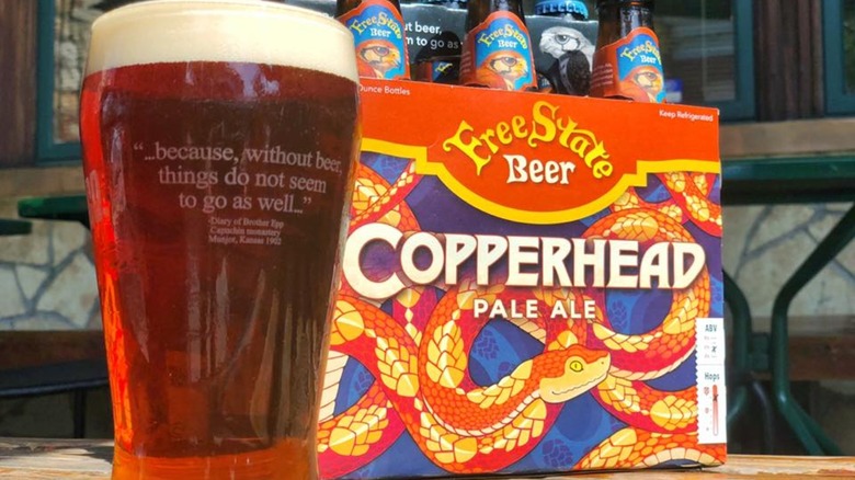 glass and six pack of copperhead pale ale beers