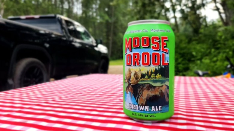 can of moose drool beer on picnic table outside