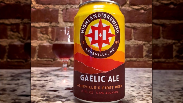 can and glass of gaelic amber ale on table