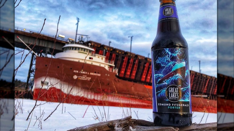bottle of edmund fitzgerald beer outside with large ship in background