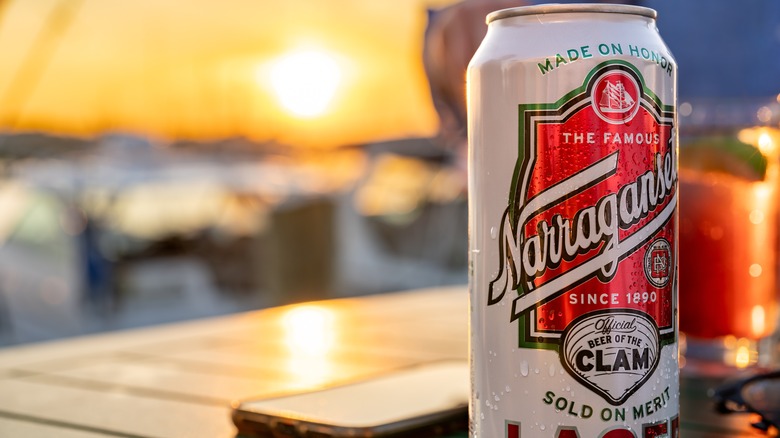 can of narragansett beer on table outside overlooking sun