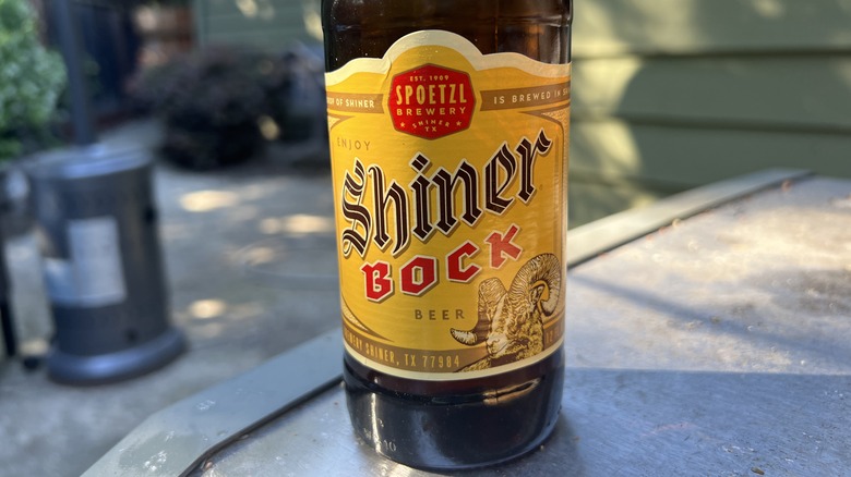 bottle of Shiner Bock beer on outdoor table