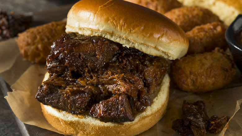 Burnt ends sandwich on platter