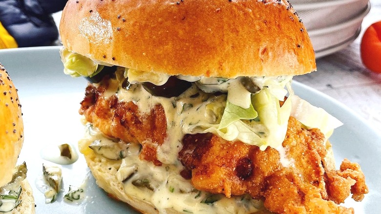Fried walleye sandwich with tartar sauce and lettuce