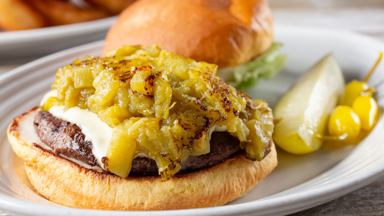 Open-faced green chili cheeseburger