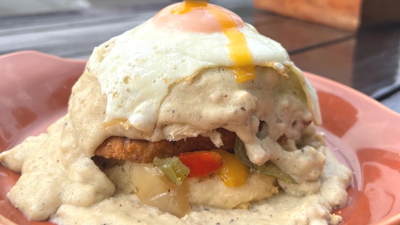 Fried chicken biscuit smothered in gravy