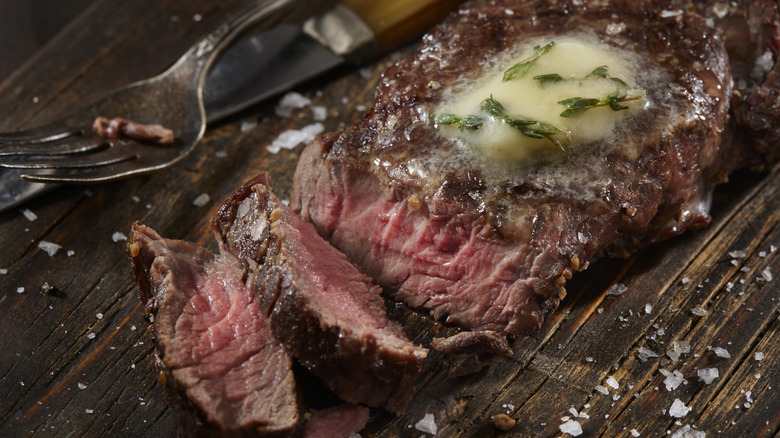 Venison steak with butter and salt