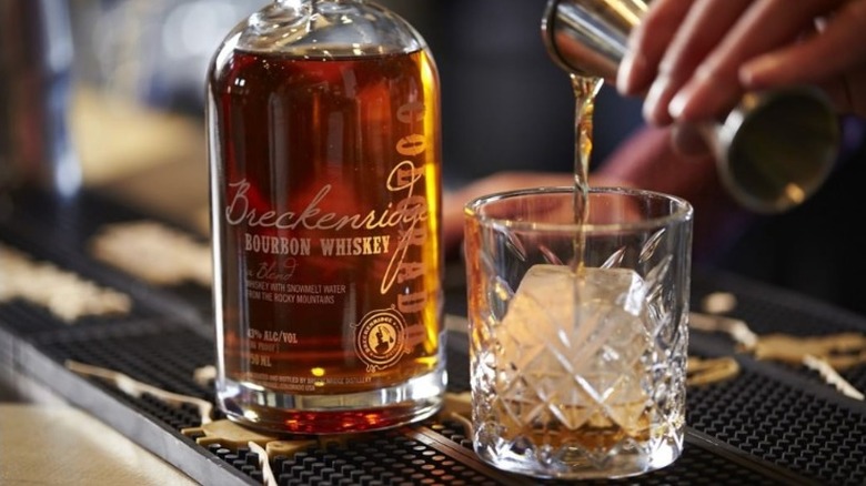 pouring Breckenridge Bourbon into glass