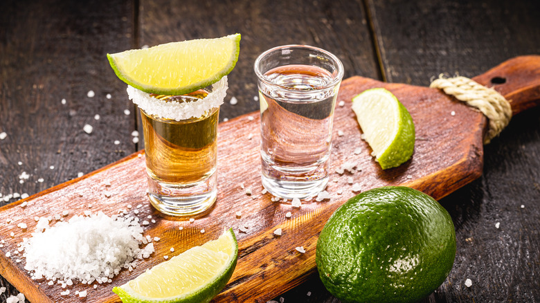 Gold silver tequila wooden board lime