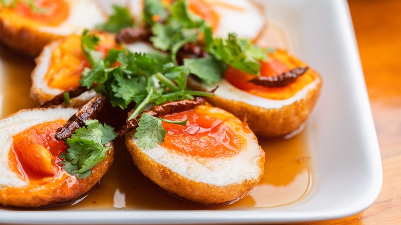 plate of thai son-in-law eggs