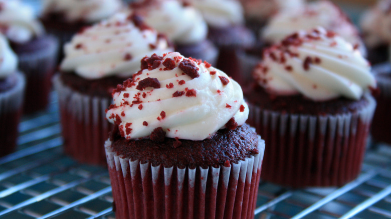 Red velvet cupcakes on wire rack