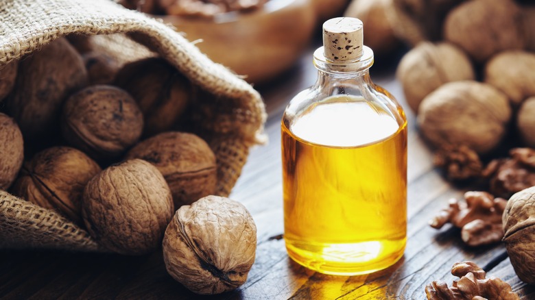 jar of walnut oil and walnuts