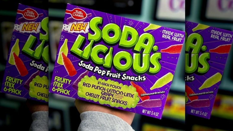 Hand holding up Soda-Licious
