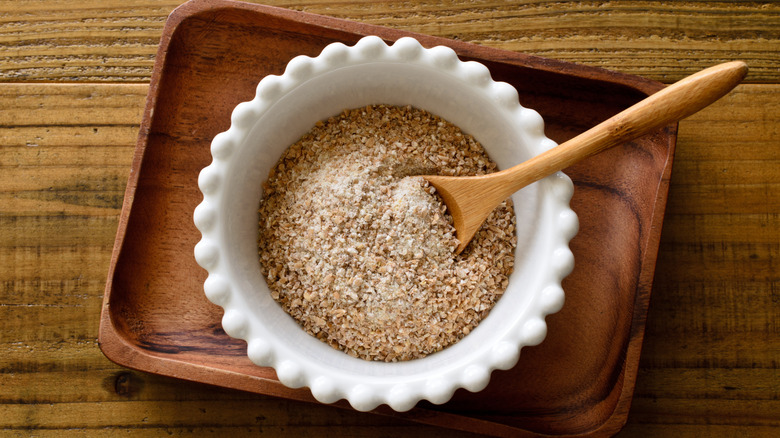 a bowl of coarse ground graham wheat flour, the original granula ingredient